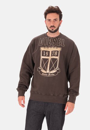 Brown cotton sweatshirt featuring a large gold "DIESEL" logo, a shield graphic, and ribbed cuffs and hem for a relaxed fit.