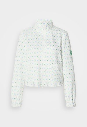 White cropped jacket with a high collar, featuring a diamond pattern of blue and green hearts, elastic cuffs, and a zip front.