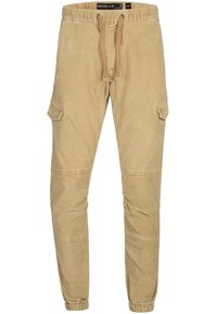 Pantalon jogger cargo beige avec taille élastique, cordon de serrage, poches latérales à rabat, coutures aux genoux et poignets élastiques.