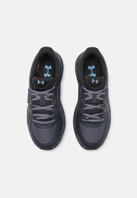 Dark grey athletic shoes with a textured upper, breathable mesh sections, and contrasting blue accents. Features traditional lacing system.