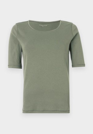 Chemise courte à manches courtes de couleur olive unie avec un col rond, présentée sur un fond blanc.