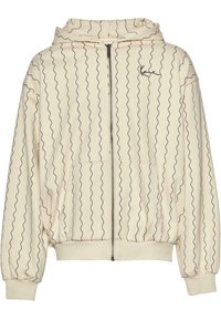 Lys beige hettegenser med bølgende svarte linjer, hel glidelås, kengurulomme og ribbestrikkede mansjetter. Mykt stoff med en avslappet passform og hette.