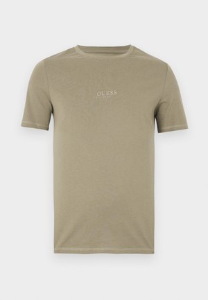 Olijfgroene T-shirt met korte mouwen, gemaakt van zachte katoen, met een ronde hals en een klein geborduurd "GUESS"-logo op de borst.