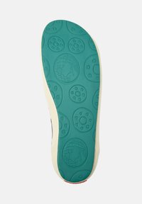 Schoenzool met een teal rubber materiaal met ronde textuurpatronen en een romige rand. Opmerkelijk wereldbolontwerp in meerdere gebieden ingegraveerd.