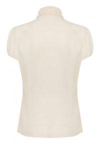Blouse couleur crème avec un col montant à volants, des manches courtes bouffantes et un tissu lisse, légèrement texturé. Vue de dos montrée.