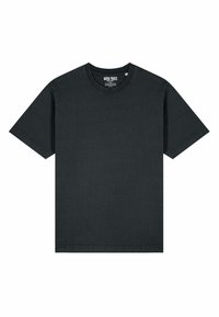 T-shirt noir en coton, manches courtes, col rond, présentant une texture subtile et sans motifs ni graphiques visibles. Étiquette au niveau du col.