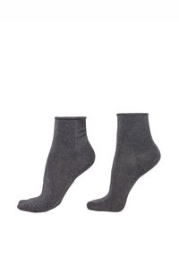 Svarta vriststrumpor med en skimrande textur, med en åtsittande passform och ett mjukt, stretchigt material. Perfekta för både vardags- och formellt bruk.