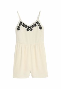 Creme jumpsuit med V-hals, tynde stropper og sort broderet blomstermønster på brystet. Blødt tekstureret stof og afslappet pasform.