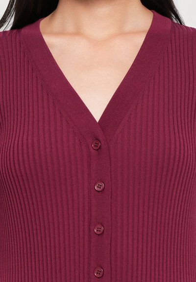 Burgundy ribbed cardigan with a V-neckline, featuring six buttons down the front. The fabric has a soft, textured appearance.