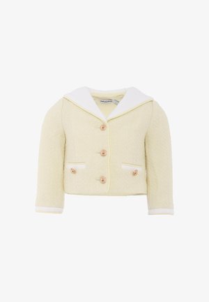 Giacca gialla in tessuto con colletto bianco, caratterizzata da tre bottoni, due tasche frontali con bordi bianchi e maniche a tre quarti.