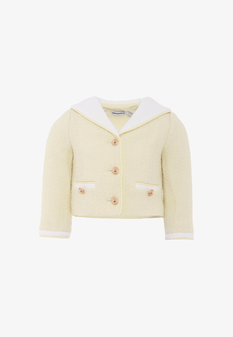 Geel gestructureerd jack met een witte kraag, voorzien van drie knopen, twee voorzakken met witte rand en cropped mouwen.