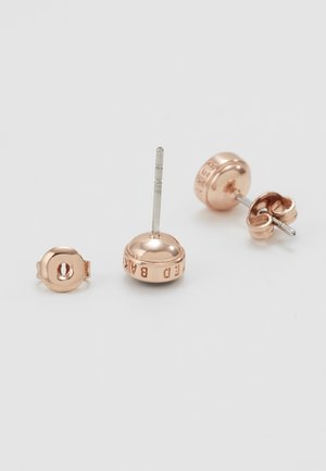 Rose gold stud earrings with engraved circular backs and butterfly clasps on a white surface.
