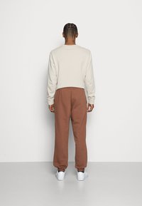 Jack & Jones JJIKANE ELLIOT  - Calças de fato de treino - aztec