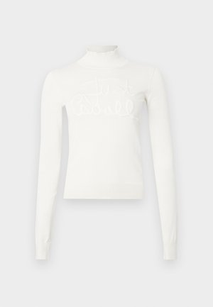 Valge, pika varrukaga kõrge kaelusega sviiter. Omab ribaga kaelaosa ja mansette, millel on tõstetud, brodüüriga tekst "Just." Pehme kudumaterjal.