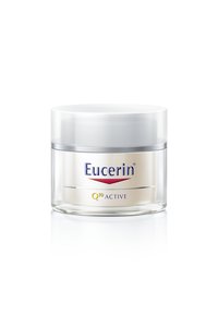 Eucerin Q10 Active cream jar, clear glass, round shape, white lid, silver accents, labeled with blue and red branding.