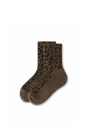 Paire de chaussettes marron à motif léopard noir, étalées à plat sur un fond blanc.