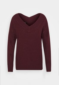 Pull en maille manches longues à col en V profond, de couleur bordeaux foncé avec une texture côtelée et des poignets ajustés, présenté sur un fond clair uni.