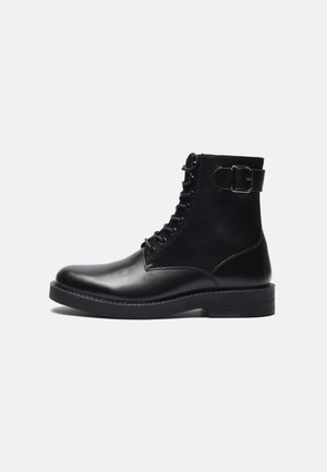 Bottines à lacets - black