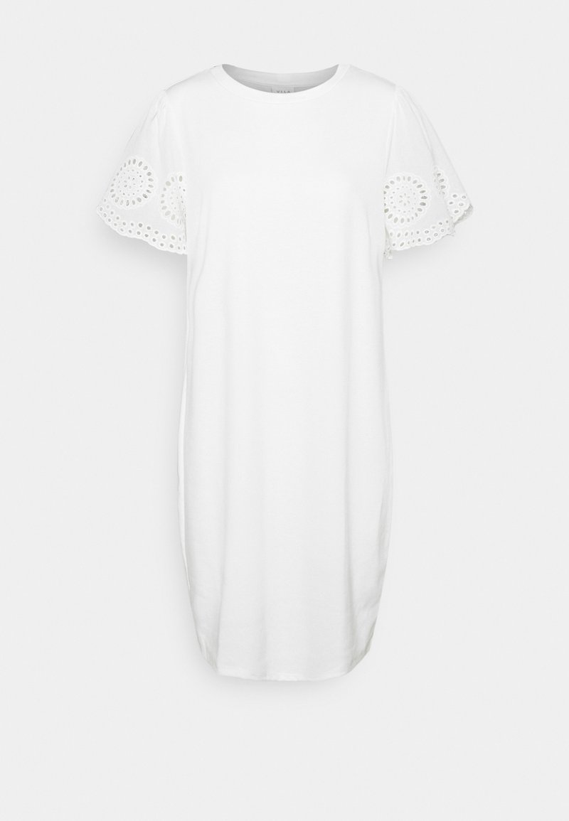 Robe blanche en coton avec un col rond et des manches courtes. Les manches présentent une broderie œillet circulaire. Forme simple, droite et longueur au genou.