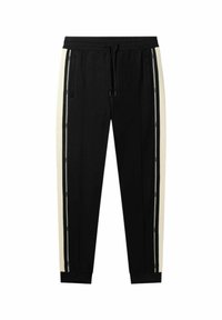 Černé sportovní kalhoty s krémovými postranními pruhy, elastickým pasem a manžetami. Disponují zipovými kapsami pro větší funkčnost.