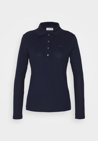Long-sleeve navy polo shirt made of soft material, featuring a classic collar, button placket, and a tonal logo accent on the chest.