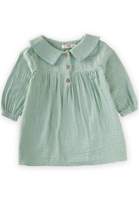 Abito di cotone verde chiaro con colletto, chiusure a bottoni e vita arricciata. Presenta maniche lunghe a sbuffo e tessuto testurizzato.