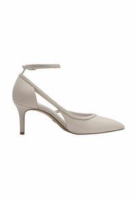 Béžová kožená bota na podpatku s špičatou špičkou a 7,5 cm vysokým stiletto podpatkem. Má třpytivý pás přes kotník a výřezové detaily na stranách.