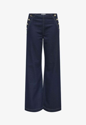 Pantalones de mezclilla oscuros de pierna ancha con una cintura alta. Presentan botones dorados a lo largo de las costuras laterales y un hilo de contraste. Textura suave.