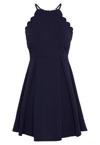 Laivaston mekko, jossa on aaltoileva pääntie, ilman hihoja ja pleatattu hame. Valmistettu venyvästä kankaasta, joka antaa rakenteellisen mutta joustavan istuvuuden.