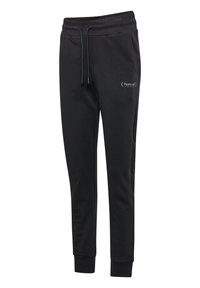 Schwarze Jogginghosen aus weichem Material. Sie verfügen über einen elastischen Bund mit Kordelzug, ein tailliertes Bein-Design und ein dezentes Logo-Detail auf der Vorderseite.