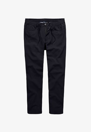 Black pants made of soft fabric, featuring an elastic waistband, drawstring, front pockets, and a zip fly with a button closure.