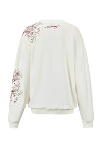 Witte sweatshirt met lange mouwen. Bevat rode vissen en draaiende ontwerpen over de schouders en langs de mouwen. Geribbelde manchetten en zoom.