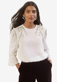 EMBELLISHED CREW NECK FLUTE SLEEVE - REGULAR FIT - Pluus - ivory white