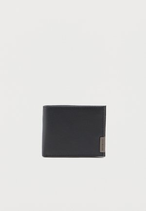 Black leather bifold wallet with a small metal tag on the bottom right corner displaying a brand name.