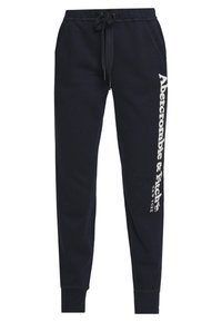 Marineblauwe sweatpants met een drawstring taille, zijzakken, cuffed enkels en een wit "Abercrombie & Fitch New York" logo op het linkerbeen.