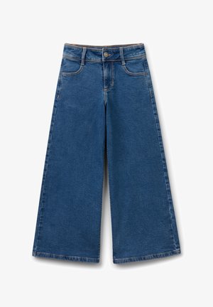 Jeans a gamba larga in denim blu scuro. Presentano una vita alta, grandi tasche frontali e cuciture visibili lungo le giunture.