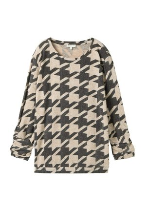 Halenka s dlouhým rukávem vyrobená z texturované tkaniny s houndstooth vzorem v béžové a černé barvě, s kulatým výstřihem a uvolněným střihem.