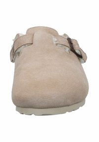 Light pink suede clog with a fuzzy interior, adjustable strap with bronze hardware, rounded toe, and textured outsole.