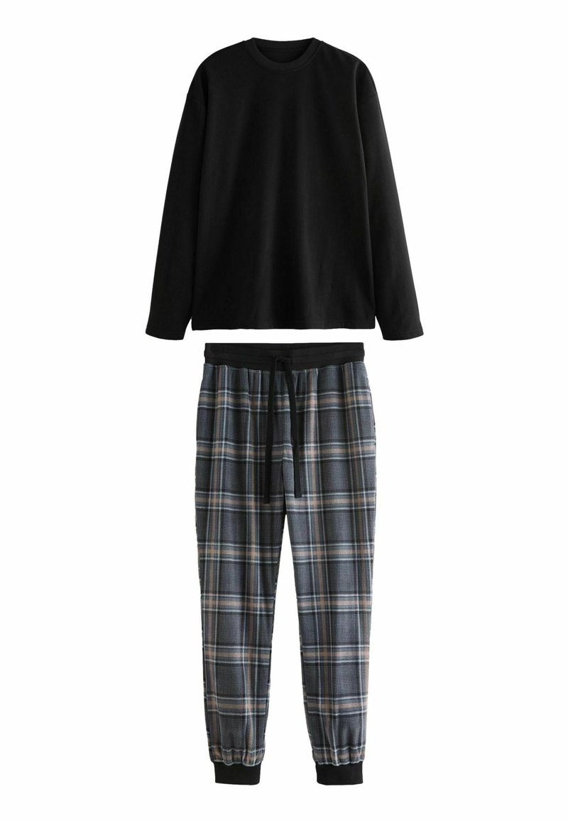 Musta pitkähihainen paita pyöreällä kaula-aukolla ja ruudulliset pyjamanhousut sinisen, harmaan ja vaaleanruskean sävyissä, joissa on joustava vyötärö ja nauhavyö.
