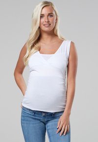 Top premaman bianco senza maniche con scollo a V. Tessuto morbido e elasticizzato con arricciature sui lati per una vestibilità comoda.
