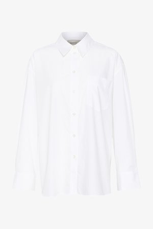 Chemise blanche à manches longues avec col, en coton. Présente un devant à boutons et une poche poitrine unique. Texture lisse, coupe décontractée.