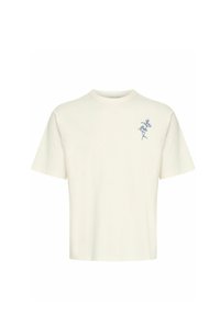 Kortærmet T-shirt med rund hals i off-white bomuld, der har en blå blomsterbroderi på venstre bryst. Glat tekstur, afslappet pasform.