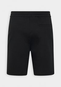 Pantaloni corti neri con vita elasticizzata e una sola tasca welt sul retro, mostrati da dietro su uno sfondo neutro.