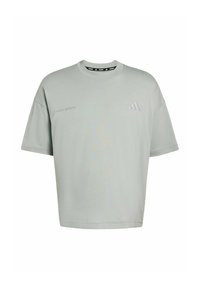 Lichtgroen oversized t-shirt gemaakt van zachte stof. Voorzien van korte mouwen, een ronde halslijn en subtiele bedrukte branding aan de voorkant.