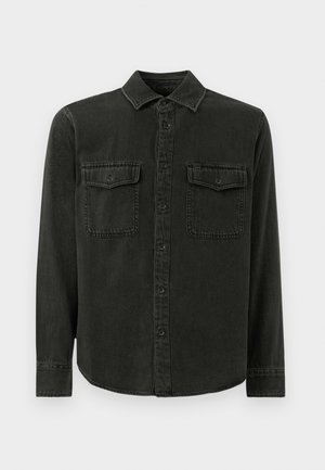 Black denim shirt featuring a collar, button front, two chest pockets, long sleeves, and a slightly curved hem.