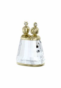 Ornamento a forma di campana in cristallo con una base chiara e sfaccettata, sormontato da due figure dorate, una adornata con una stella e l'altra con un accento rotondo.