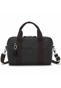 Black fabric handbag featuring brown webbing handles and shoulder strap, zip closure, and a textured finish with a logo patch and keychain detail.