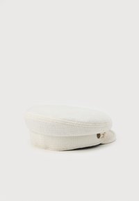 Cream-colored textured fabric newsboy cap with a small decorative button on the side, placed on a white background.