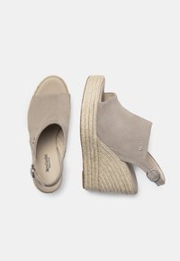 Beige suede wedge sandals with a rounded open toe, jute-wrapped platform, and a buckle closure at the ankle. Smooth inner lining.