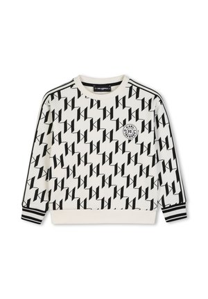 Sweat-shirt blanc à manches longues avec motif diagonal noir "K", poignets rayés noir et blanc et patch logo rond sur la poitrine gauche.